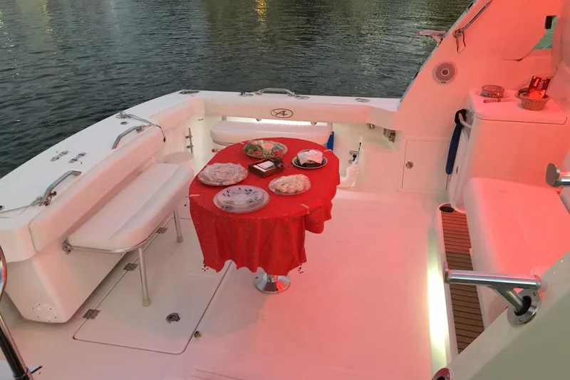 Slide: The Image of 2015 Albemarle 360 Express Fisherman boat with a red tablecloth dining setup. - 38