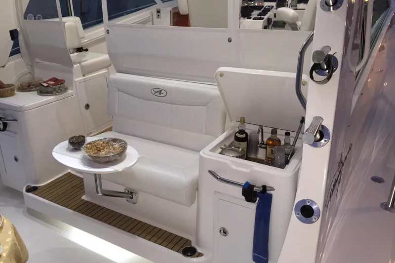 Slide: The Image of 2015 Albemarle 360 Express Fisherman interior with seating and built-in bar. - 39
