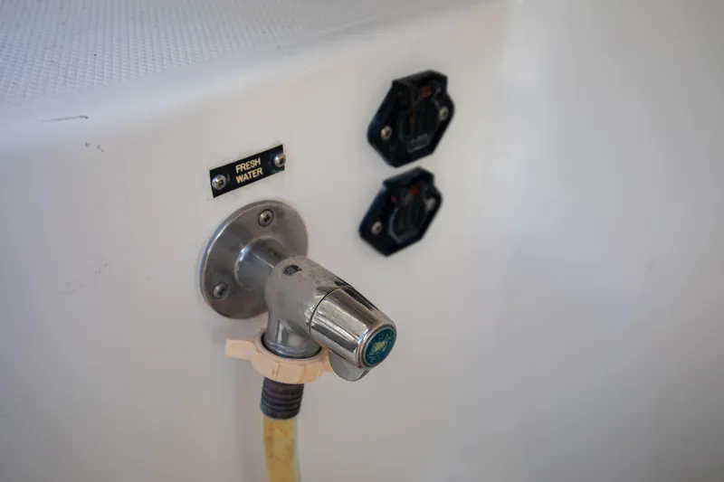 Slide: The Image of Freshwater outlet on 2015 Albemarle 360 Express Fisherman boat. - 43