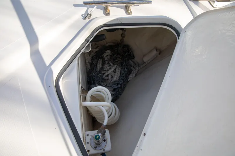 Slide: The Image of Open storage compartment on 2015 Albemarle 360 Express Fisherman boat deck. - 47