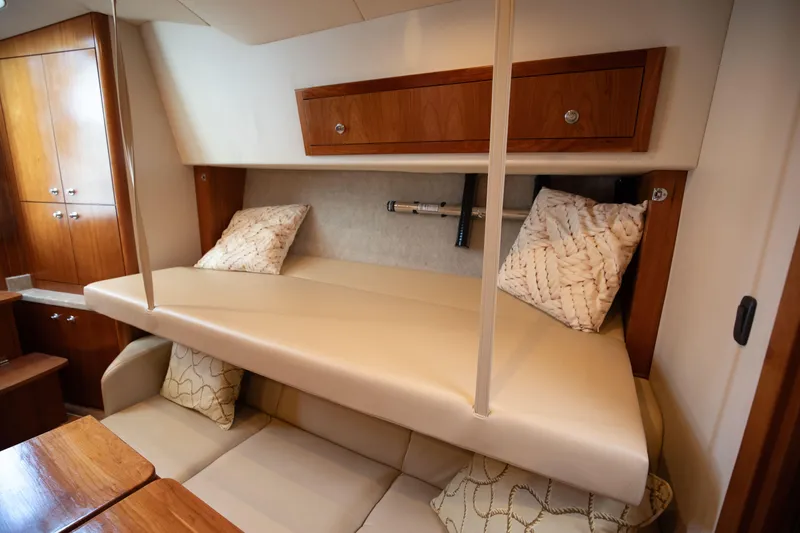 Slide: The Image of 2015 Albemarle 360 Express Fisherman cabin interior with seating and storage. - 51