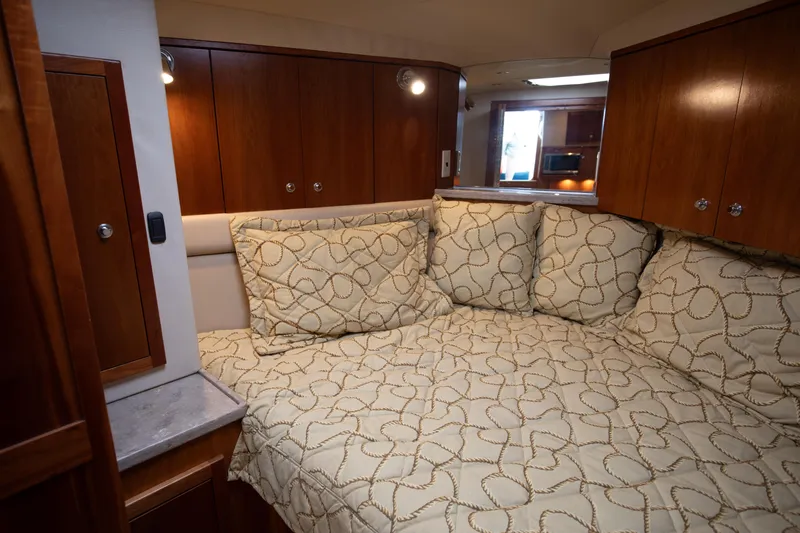 Slide: The Image of 2015 Albemarle 360 Express Fisherman cabin with cozy bedding and wooden cabinetry. - 57
