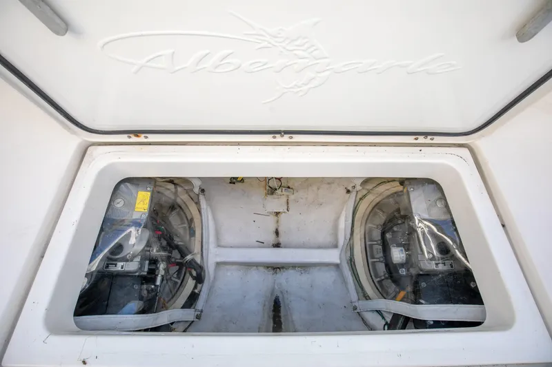 Slide: The Image of Engine compartment of 2015 Albemarle 360 Express Fisherman boat, showcasing dual engines. - 77