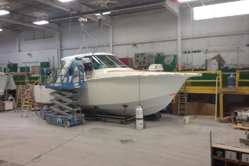 Slide: The Image of 2015 Albemarle 360 Express Fisherman boat under maintenance in a workshop. - 87