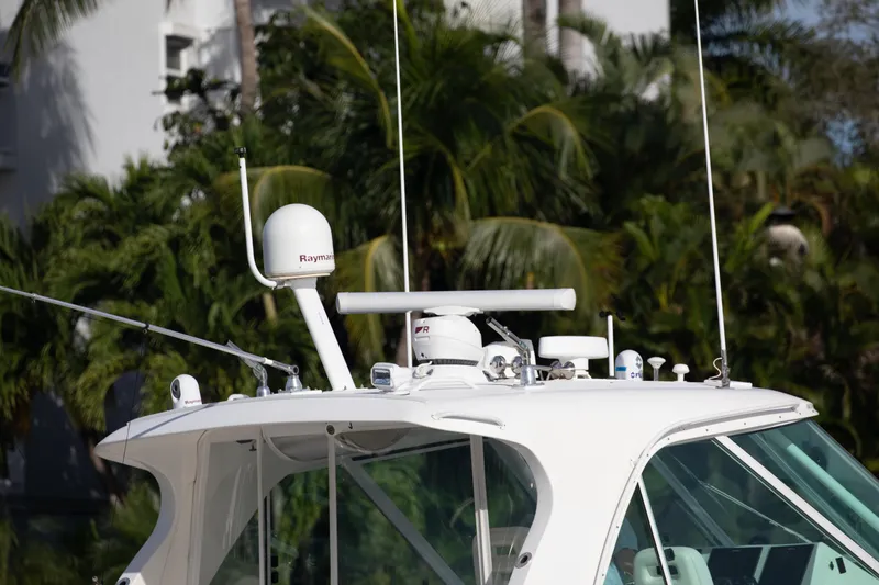 Slide: The Image of 2015 Albemarle 360 Express Fisherman boat with radar equipment, surrounded by lush greenery. - 9