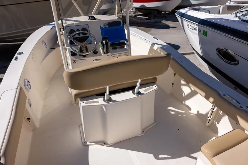 Slide: The Image of 2020 Scout 195 Sportfish boat interior with steering console and seating. - 4