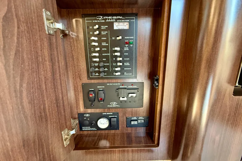 Slide: The Image of Control panel of 2018 Regal 28 Express boat with wood finish. - 17