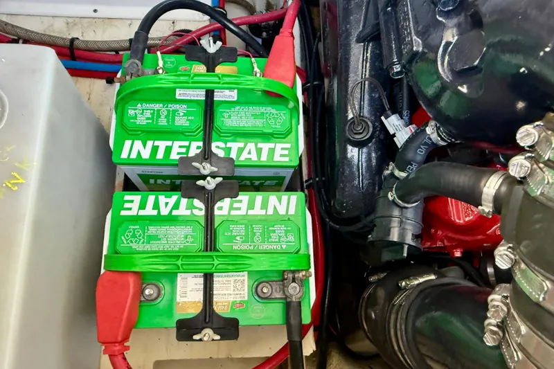 Slide: The Image of Interstate batteries in 2018 Regal 28 Express engine compartment, showcasing wiring and components. - 47