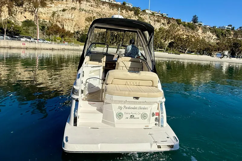 Slide: The Image of 2018 Regal 28 Express boat cruising in scenic coastal waters. - 5