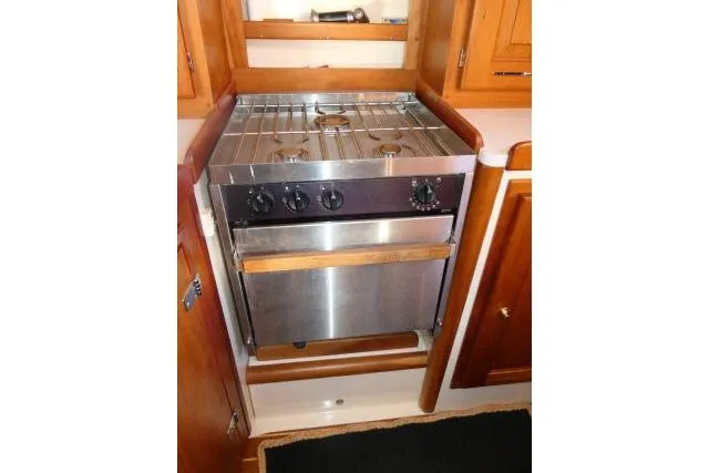 Slide: The Image of Stainless steel stove in 2002 Tartan 3700 yacht kitchen with wooden cabinetry. - 17