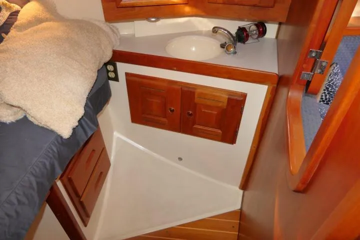 Slide: The Image of Cozy Tartan 3700 yacht bathroom with wooden cabinets and compact sink, 2002 model. - 32