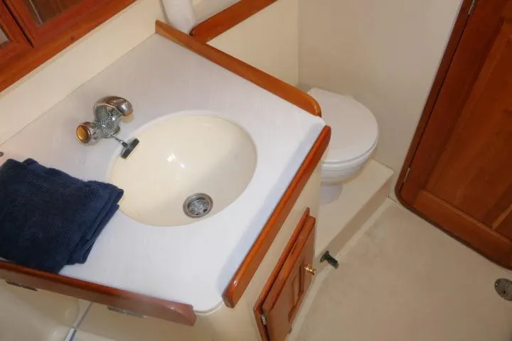 Slide: The Image of Bathroom interior of 2002 Tartan 3700 yacht with sink and toilet. - 41