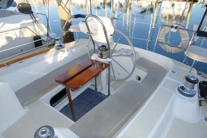 Slide: The Image of Cockpit of 2002 Tartan 3700 sailboat with steering wheel and seating. - 50