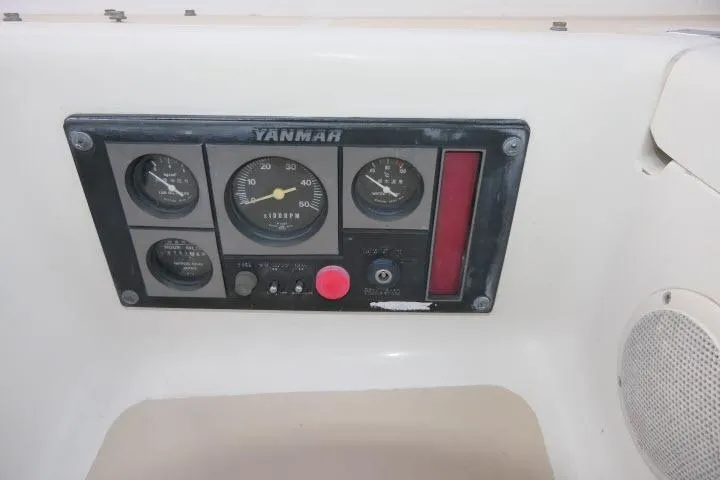 Slide: The Image of Control panel of a 2002 Tartan 3700 sailboat with Yanmar engine gauges. - 55