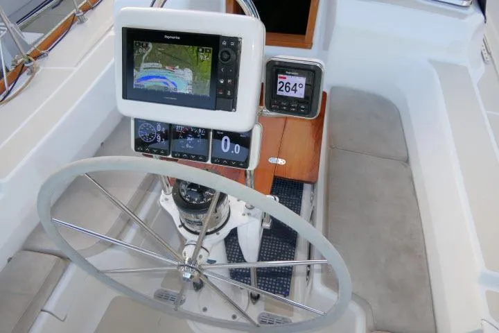 Slide: The Image of Steering wheel and navigation instruments on a 2002 Tartan 3700 sailboat. - 56