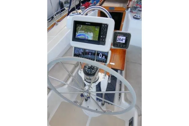 Slide: The Image of Steering wheel and navigation system on a 2002 Tartan 3700 sailboat. - 57
