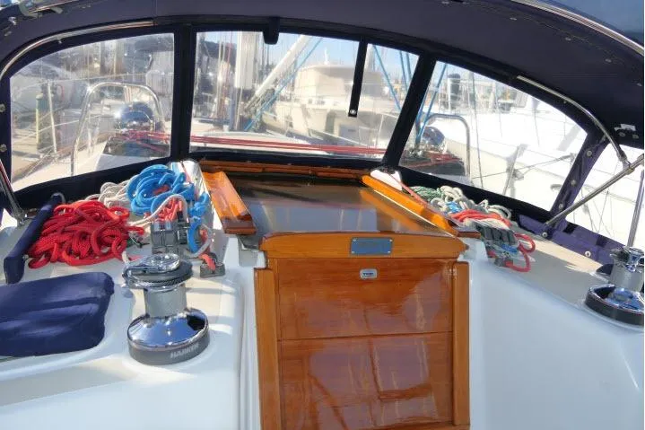 Slide: The Image of Cockpit of 2002 Tartan 3700 sailboat with ropes and winches. - 61