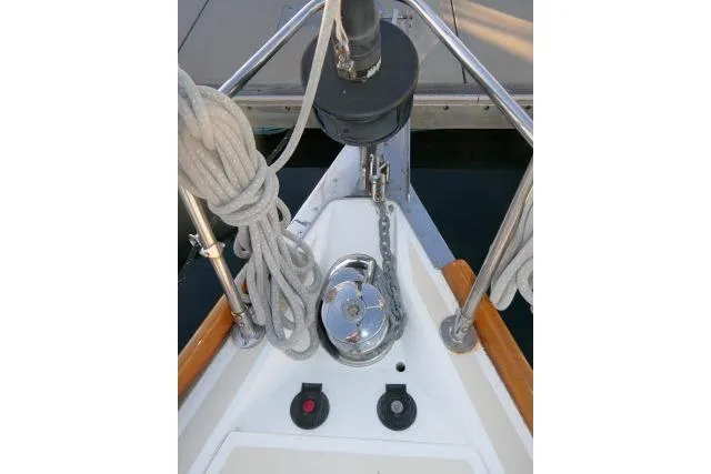 Slide: The Image of Bow of 2002 Tartan 3700 sailboat with anchor chain and ropes. - 72
