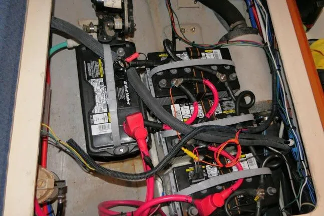 Slide: The Image of Battery compartment of a 2002 Tartan 3700 sailboat with wiring and connections. - 88