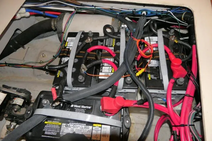 Slide: The Image of Battery compartment of a 2002 Tartan 3700 sailboat with wiring and connections. - 89