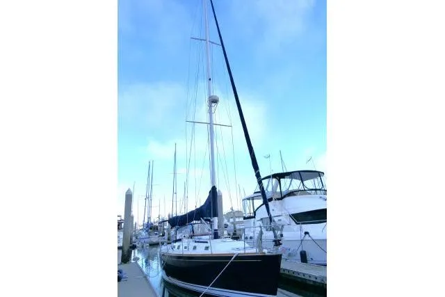 Slide: The Image of Sailboat docked at marina, Tartan 3700, 2002 model, clear sky background. - 92