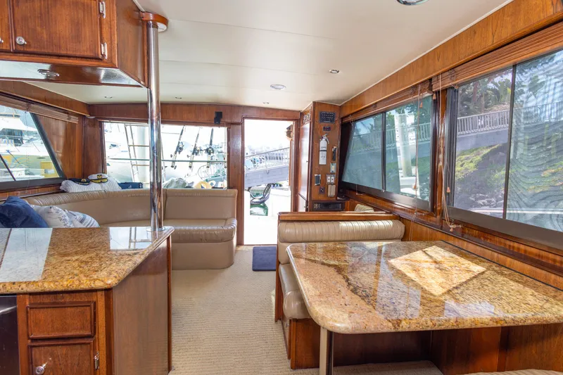 Slide: The Image of Interior of 1987 Hatteras 52 Convertible yacht with wood finishes and granite surfaces. - 104