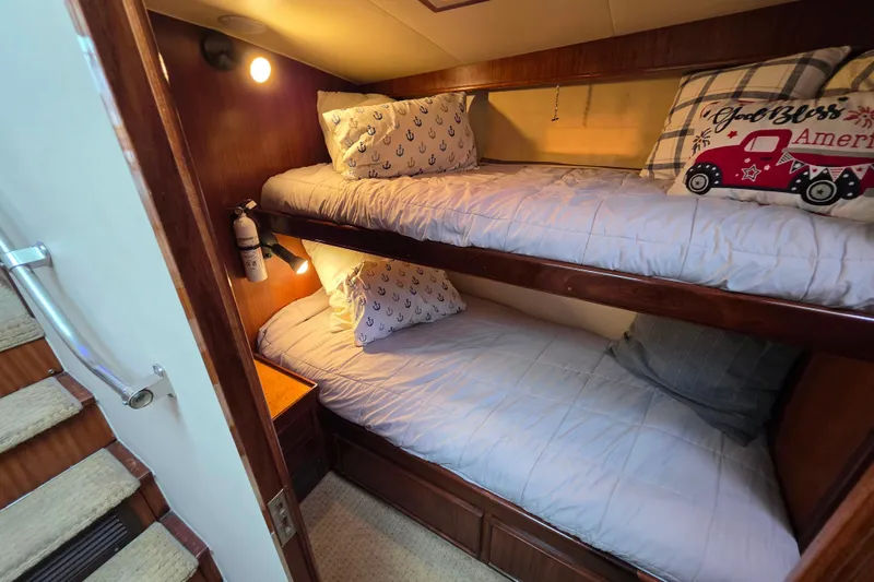Slide: The Image of Cozy bunk beds in 1987 Hatteras 52 Convertible yacht cabin. - 34