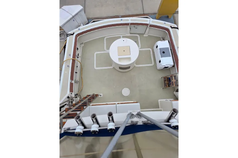 Slide: The Image of 1987 Hatteras 52 Convertible yacht deck with seating and equipment. - 42