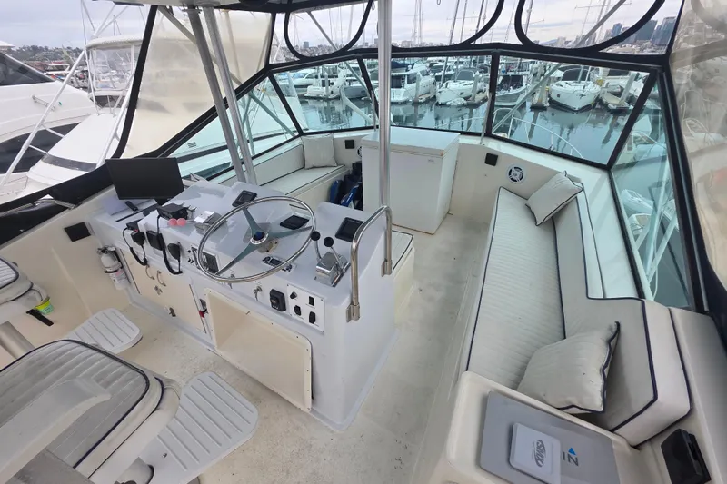 Slide: The Image of Interior view of 1987 Hatteras 52 Convertible yacht cockpit with steering wheel and seating. - 50