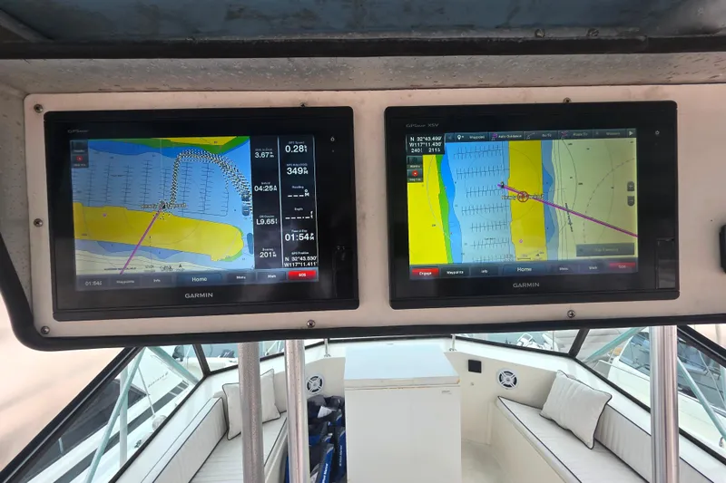 Slide: The Image of Dual Garmin navigation screens on a 1987 Hatteras 52 Convertible yacht. - 54