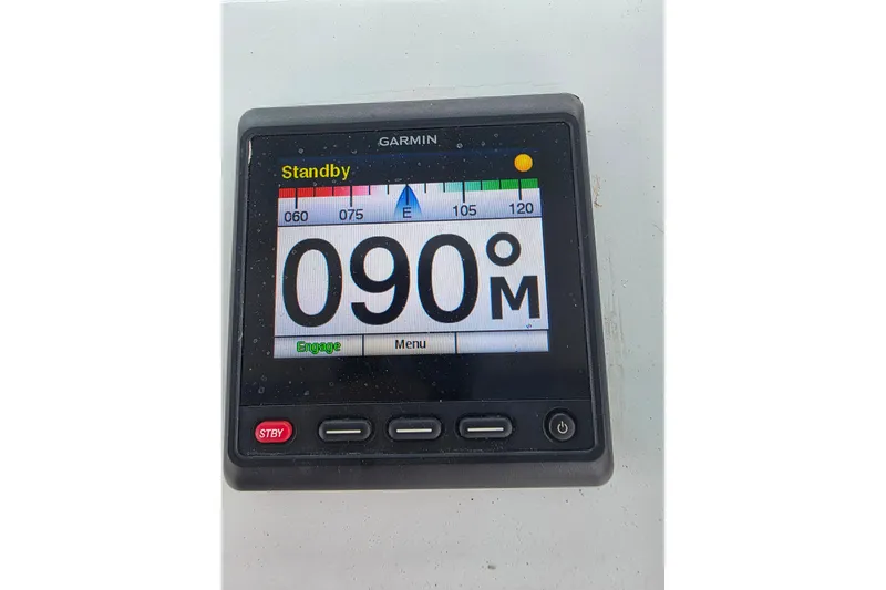 Slide: The Image of Garmin marine display showing 090 degrees on Hatteras 52 Convertible, 1987 model. - 57