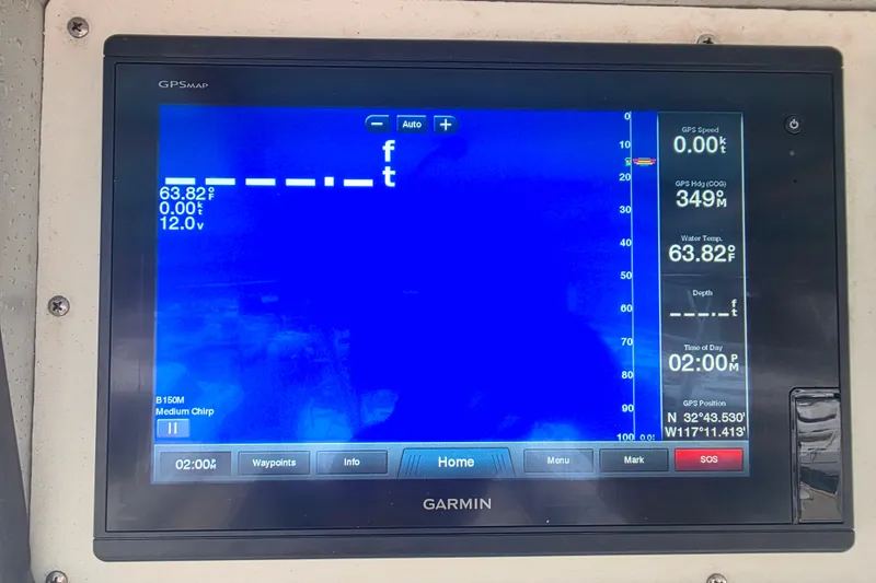 Slide: The Image of Garmin GPS display on 1987 Hatteras 52 Convertible, showing navigation and water temperature. - 60