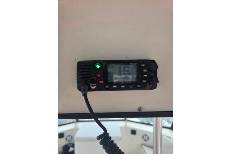 Slide: The Image of VHF radio on 1987 Hatteras 52 Convertible boat dashboard. - 61