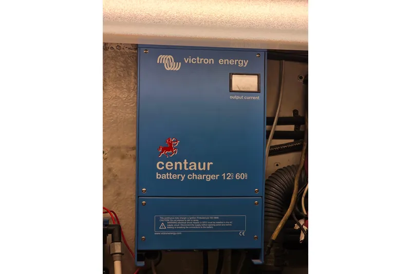 Slide: The Image of Blue Victron Energy Centaur battery charger in 1987 Hatteras 52 Convertible yacht. - 70