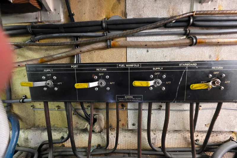 Slide: The Image of Fuel manifold control panel on a 1987 Hatteras 52 Convertible boat. - 72