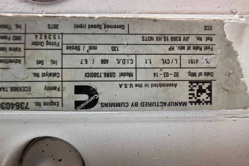 Slide: The Image of Engine specification label for a 1987 Hatteras 52 Convertible boat. - 78