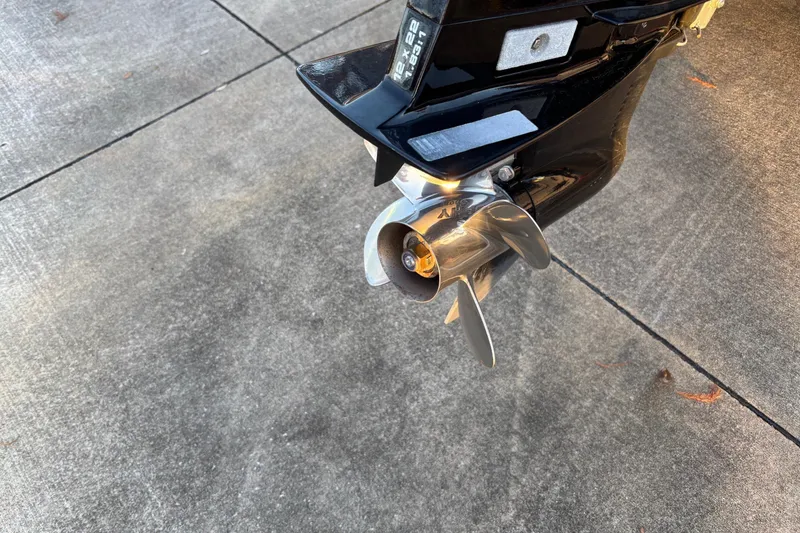 Slide: The Image of Propeller of a 2005 Bass Tracker V18 boat on concrete surface. - 13