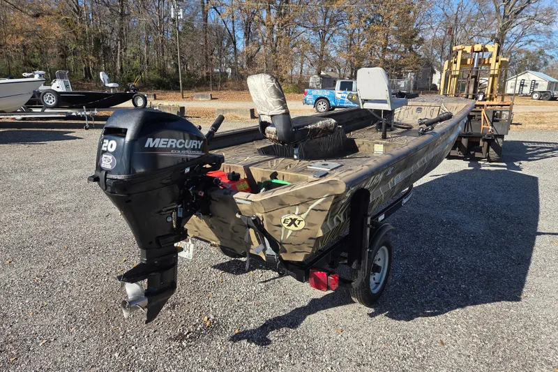 Slide: The Image of 2018 SeaArk DXS 1548 DKLD boat with Mercury 20 HP outboard motor on trailer. - 5