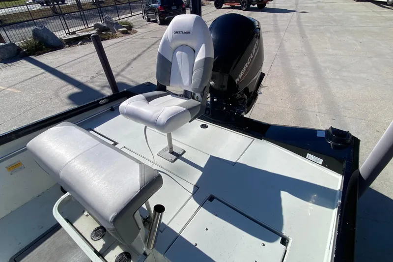 Slide: The Image of 2019 Crestliner 1800 Bay boat with seating and Mercury outboard motor. - 21