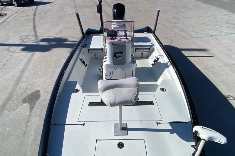 Slide: The Image of 2019 Crestliner 1800 Bay boat interior with seating and control console. - 9