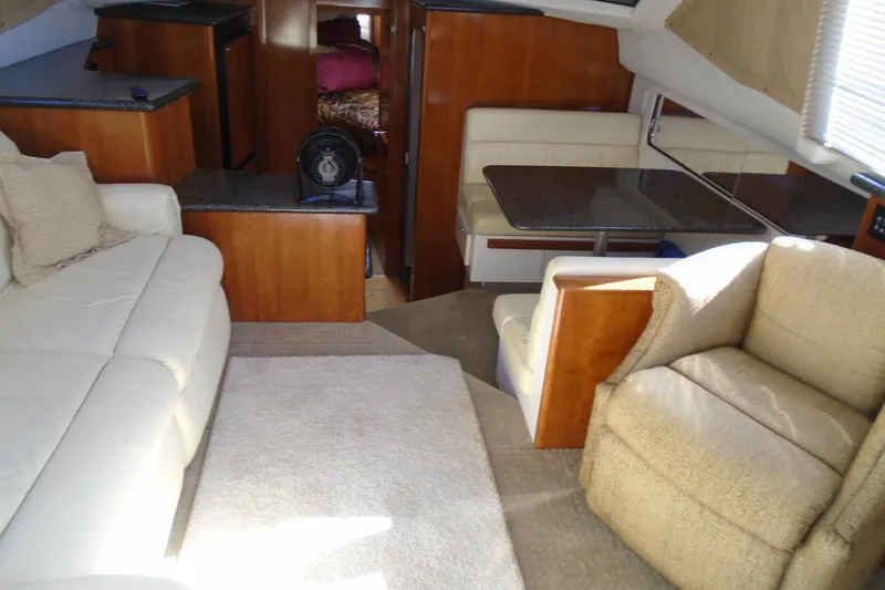 Slide: The Image of Interior of 2004 Carver 356 Motor Yacht with cozy seating and dining area. - 20