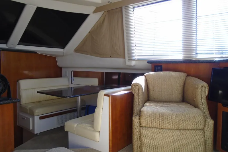Slide: The Image of Interior of 2004 Carver 356 Motor Yacht with seating and dining area. - 23
