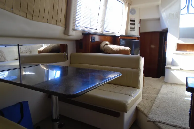 Slide: The Image of Interior of 2004 Carver 356 Motor Yacht with dining area and seating. - 28