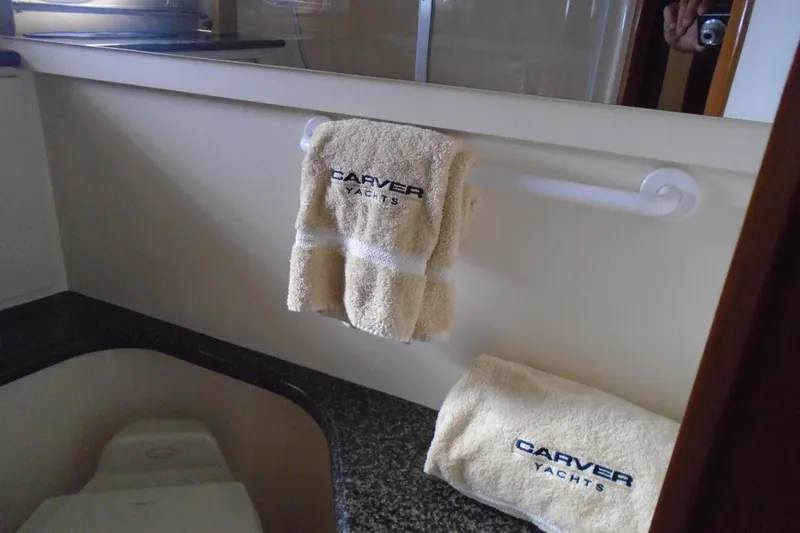 Slide: The Image of Bathroom of 2004 Carver 356 Motor Yacht with branded towels on display. - 45