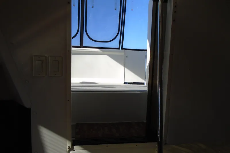 Slide: The Image of Interior view of 2004 Carver 356 Motor Yacht with sunlight through windows. - 57
