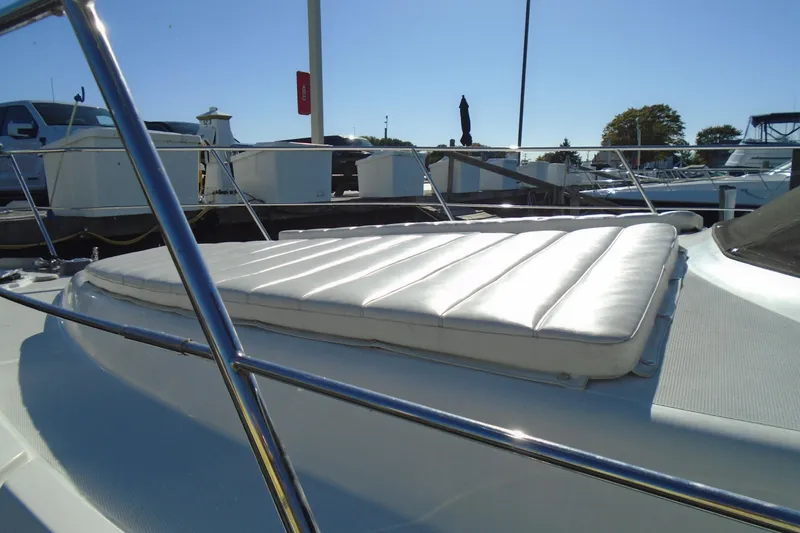 Slide: The Image of 2004 Carver 356 Motor Yacht with sunpad, docked at marina under clear blue sky. - 60
