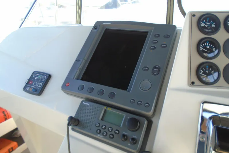 Slide: The Image of Control panel of 2004 Carver 356 Motor Yacht with navigation and communication equipment. - 16