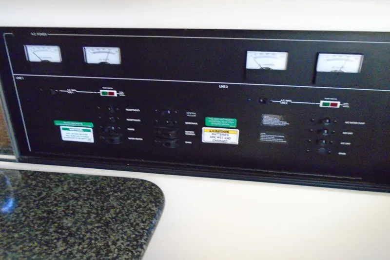 Slide: The Image of Control panel of a 2004 Carver 356 Motor Yacht with gauges and switches. - 30