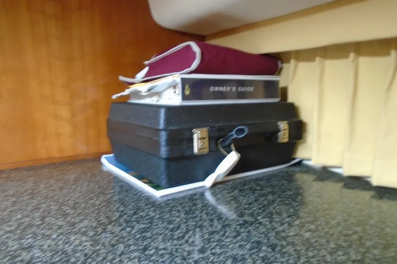 Slide: The Image of Stacked owner's guide and case on Carver 356 Motor Yacht, 2004 model. - 35