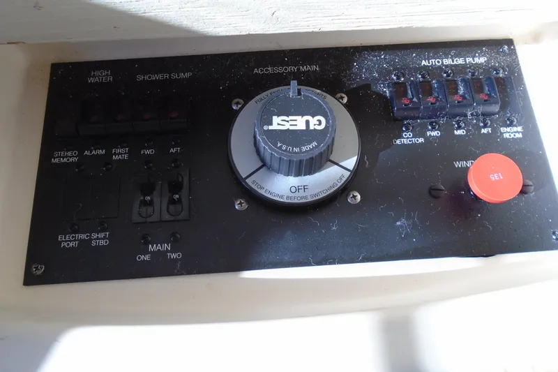 Slide: The Image of Control panel of a 2004 Carver 356 Motor Yacht with various switches and dials. - 50
